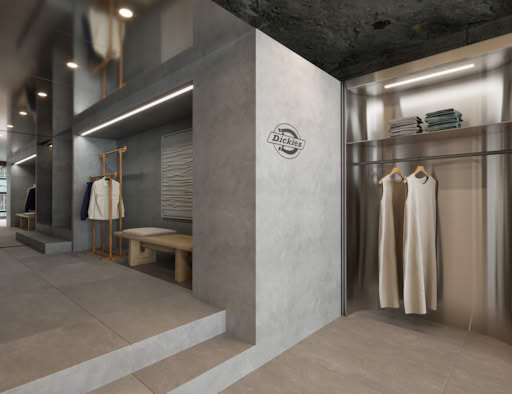 Minimalist Dickies store interior with fitting area, modern racks, and concrete finish design.