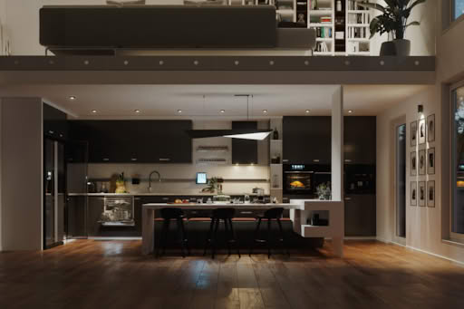 Modern kitchen with black cabinets, white island, and wooden floor.
