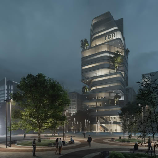 Night view of TDR Tower with illuminated glass façade, modern architecture, and landscaped public plaza.