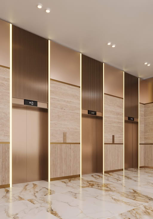 Modern elevator lobby with marble floors and gold accents.