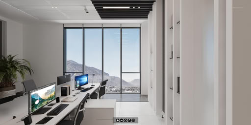 360-degree virtual reality view of a contemporary office interior with open plan workstations, lounge seating area, decorative plants, and sleek ceiling lights.